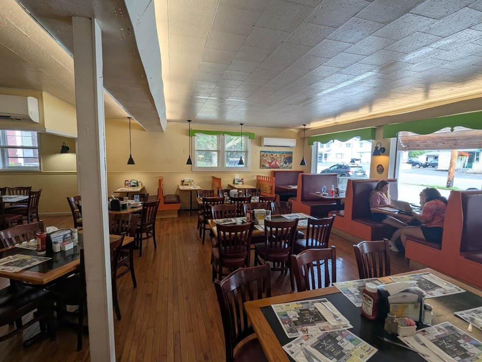 Breakfast plates served in a quiet restaurant setting.